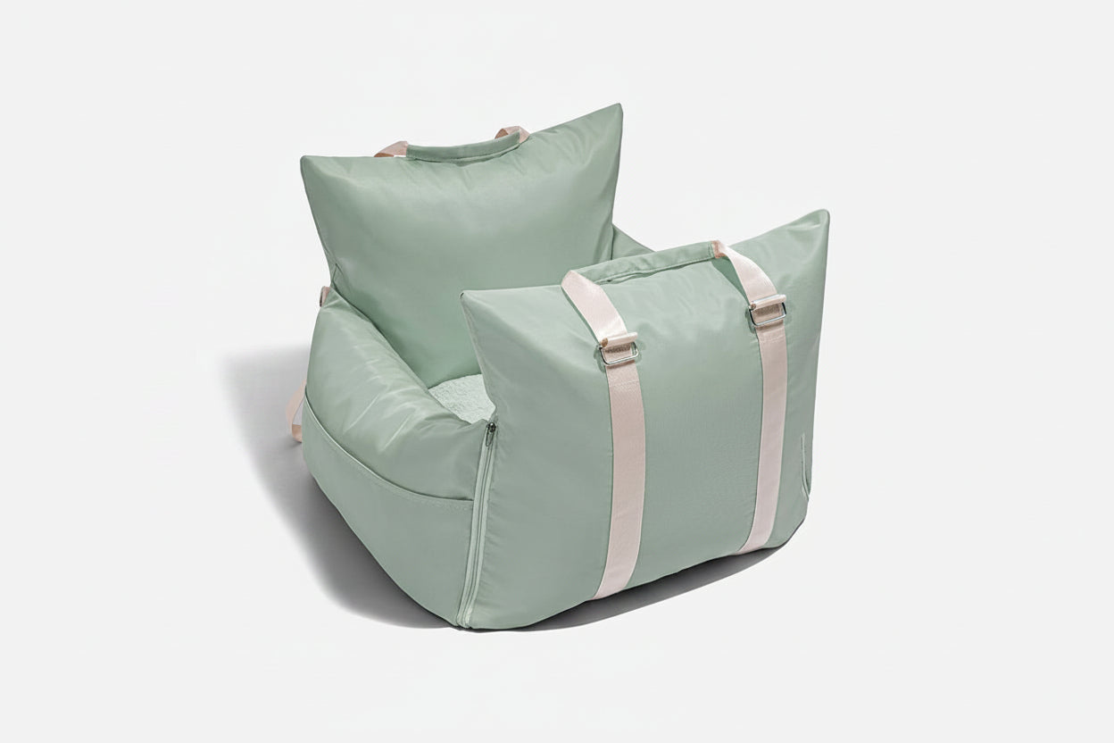 Light green bean bag chair with pink straps on a white background