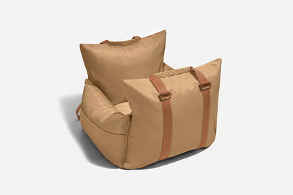 Beige bean bag chair with brown straps on a white background