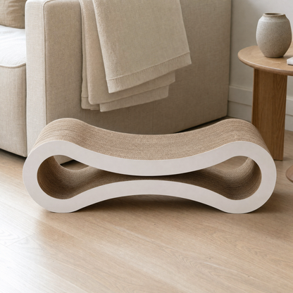 Nesta scratcher beside a linen sofa